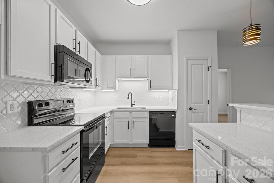 This move-in ready second-floor condo offers a desirable split-bedroom floor plan with 9-foot ceilings throughout. Recent updates include new LVP flooring, fresh interior paint, and updated lighting. The kitchen features white cabinetry, new quartz countertops, a tile backsplash, and new black appliances. HOA dues include water, sewer, garbage and exterior maintenance. Community amenities include a dog park, picnic tables, and walking trails.