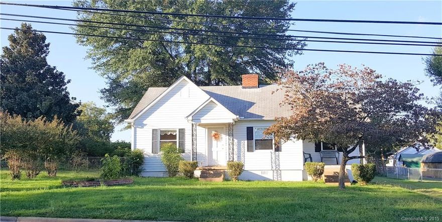 2BR/1BA home situated on close to an acre that includes the lot next door. Beautiful tree lined rear & side yard is completely level & fenced. This hard to find home is move-in ready complete w/new windows & hardwood floors throughout. Generous sized kitchen includes refrigerator & range and also a separate laundry/utility room. Huge detached insulated garage/workshop includes 2 -10ft doors, power, air lines and is ready for your car enthusiast! New roof installed in November 2015.