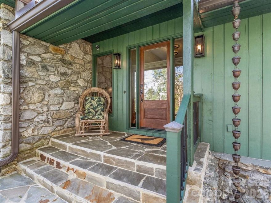 Tucked away on a private wooded lane just 7 minutes from downtown Asheville, this rare estate offers 3 bedrooms, 2 baths, and a desirable split-bedroom floor plan with 2,165 sq ft of main-level living, plus a 300 sq ft loft, a full unfinished basement, and exceptional additional space including a separate workshop/artist studio, dedicated utility area, and an oversized garage of over 500 sq ft. Dramatic vaulted ceilings create an open, airy feel, while the home’s thoughtful layout provides both comfort and privacy.

Surrounded by mature trees, curated native plantings, and abundant wildlife, the setting feels like a private arboretum, yet you’re only 5 minutes to everyday conveniences including Whole Foods, Trader Joe’s, Publix, and The Fresh Market.

This unique property includes a separately deeded, buildable lot with mountain views, offering flexibility for future expansion, guest home, or investment potential. With county taxes only, enjoy significant savings while still being close to everything Asheville has to offer.

Thoughtful updates include a new roof (2024), new driveway (2025), four new thermopane sliding glass doors (2023), and two oversized picture windows (2025) that bring in natural light and frame the surrounding landscape. A Stay Dry basement system with transferable warranty adds peace of mind.

Inside, enjoy hardwood and tile flooring throughout, a main-level pantry/laundry room, and two fireplaces—including one in the primary bedroom for a cozy retreat. Modern conveniences include a security system and high-speed fiber optic internet.

Outdoor living is equally impressive, with a giant boulder fire pit, over an acre of fenced yard, and ample space for gardens, a pool, or even a pickleball court. The landscape is a haven for wildlife, where you’ll regularly enjoy everything from hummingbirds to soaring eagles.

A truly one-of-a-kind property offering privacy, flexibility, and natural beauty—with no comparable setting this close to downtown Asheville.