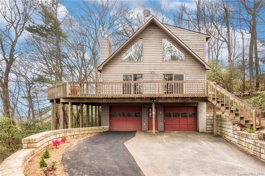Stunning mountaintop getaway in a convenient South Asheville location. This contemporary home has views in all directions. Features include vaulted ceilings, ample windows and sliding glass doors for great natural light, gas fireplace with custom concrete hearth and updated kitchen. Master suite has skylight and garden tub. A loft and bonus room in lower level provide private spaces to relax. Breathtaking year-round, long-range mountain views from the wrap-around porch. See brochure for details.