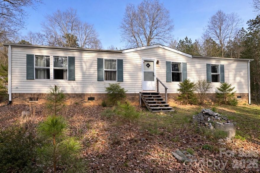 Private Mountain Retreat in Lake Lure! This charming WNC mountain property spans over 2 private acres, offering the perfect blend of comfort, functionality and self-sufficient living. The 3BR/2BA home features open concept living and  includes a cozy wood-burning stove, ideal for cool mountain evenings! The property is thoughtfully equipped for homesteading with raised garden beds, a chicken coop, and a peaceful backyard pond. A fenced back yard provides space for pets, gardening, or outdoor enjoyment, while multiple outbuildings offer excellent storage and workspace options. Surrounded by natural beauty yet conveniently located to Lake Lure, Old Fort, Asheville, and more! This property is ideal for full-time living, a mountain getaway, or investment opportunity!