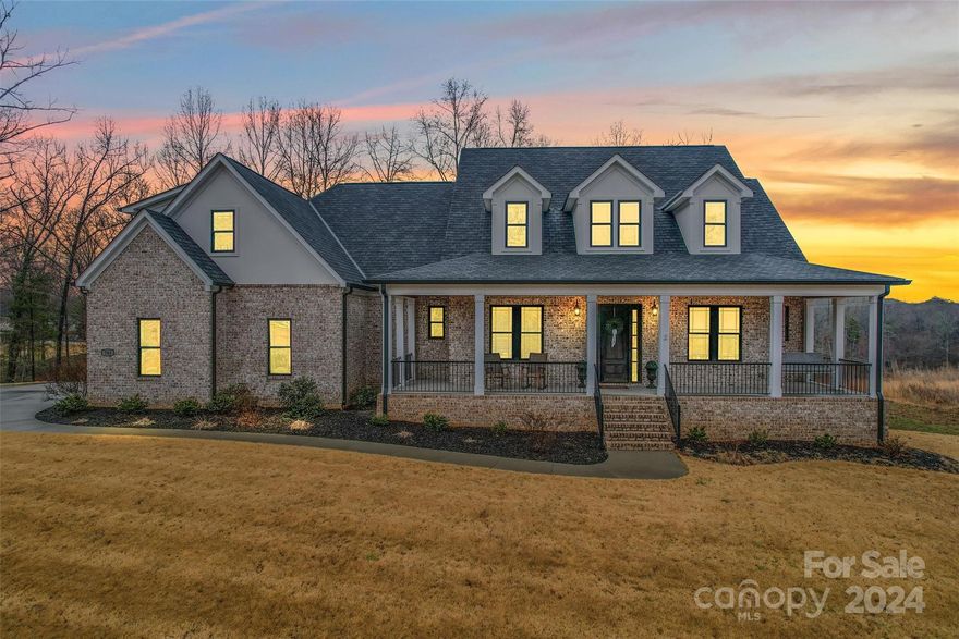 Immaculate custom built ranch home on a beautiful 1.32-acre lot with water views of popular Lake Wylie. The kitchen is a chefs dream w/ large, leathered granite top island, SS appliances, separate bar w/ beverage fridge, ice maker, induction cooktop, and walk-in pantry. A layout truly perfect for entertaining w/ large living room, gas log fireplace, and elegant built-ins. A bright study can be found at the front of the home gleaming with tons of natural sunlight. Luxury primary suite is located on the main floor w/ soaking tub surrounded by an oversized rain shower, walk-in closet with custom shelving. Two additional bedrooms located on the main floor w/ French door closets sharing a J+J bathroom with tons of cabinet space. Travel upstairs above to the garage to the bonus room equipped with a full bath. Perfect for a game room, or guest suite. Tons of possibilities with the private backyard. Great location, and award-winning school district.