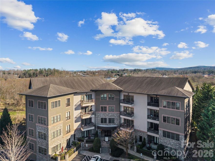 With gorgeous views of downtown Hendersonville and the Blue Ridge Mountains, this desirable 1bedroom plus a bonus room/office, 2-bath, third-floor condo offers the ideal blend of comfort, style, and convenience. Whether you’re looking for a full-time luxury residence or the perfect mountain getaway, this home delivers. Located in the sought-after Plaza In The Mountains community, you’ll love being just a short walk from Hendersonville’s charming downtown shops, restaurants, and entertainment. Park the car and enjoy a truly walkable lifestyle. Inside, beautiful appointments are found throughout, including high ceilings, crown molding, engineered hardwood floors, and 8’ doors that add to the open, airy feel. The inviting living room features a cozy gas fireplace and large windows that frame the mountain and city views. The stylish kitchen is perfect for cooking and entertaining, with granite countertops, a breakfast bar, stainless steel appliances, and a gas range. An open dining area flows seamlessly from the kitchen and living room, creating a comfortable space for gatherings with family and friends. The spacious primary suite includes a walk-in closet and a well-appointed bath with a double granite vanity and tub/shower combo. A comfortable bonus room/office and full guest bath provide a welcoming space to spread out. Step out onto the balcony to relax and take in the stunning views—an ideal spot for morning coffee or evening unwinding. Plaza In The Mountains offers excellent amenities, including a fitness room, community terrace with grill, and assigned parking in the garage. Ecusta Trail access is just minutes away, offering even more opportunity to enjoy the outdoors. Call to schedule your appoinment today!