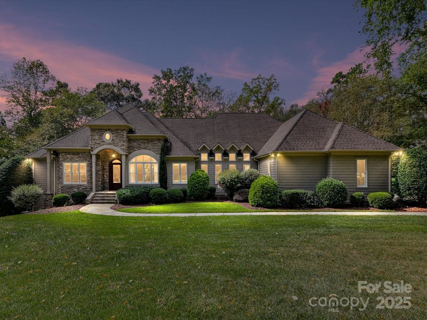 Welcome to 168 Brownstone Drive—an exquisite waterfront retreat in the heart of The Point, Mooresville’s premier lakefront community. Beautifully updated and meticulously maintained, this stunning ranch-style home with finished walk-out basement offers the ultimate blend of luxury, privacy, and access to the lake lifestyle—complete with a deeded boat slip just five doors down.

Inside, you’ll find a reimagined gourmet kitchen with top-of-the-line appliances, custom cabinetry, quartzite countertops and expansive island perfect for entertaining. Freshly refinished hardwood floors, updated bathrooms, fresh paint, and designer finishes elevate every inch of the interior. The main level features an elegant primary suite with spa-like bath and generous walk-in closet, plus two additional bedrooms with en-suite access.

The lower level is a true showstopper—ideal for multigenerational living or entertaining—with a sleek second kitchen/bar, high ceilings, a spacious rec room, private guest suite, two offices, and workshop space. It flows seamlessly out to a new travertine terrace with outdoor fireplace, built-in grilling station, and views of the peaceful cove.

Enjoy evening strolls along your private boardwalk leading to the water, or imagine relaxing poolside with the included pool rendering offering a vision for your dream backyard oasis. Tucked on a lush, tree-lined lot, this home offers both serenity and proximity to The Point’s world-class amenities—golf, tennis, dining, and more (with separate TNG membership).

Whether you’re seeking a full-time residence or lakefront retreat, this updated gem offers the space, style, and setting to live your best Lake Norman lifestyle.