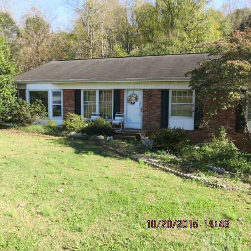 Brick & vinyl ranch has large living room, den, laundry. Front masonry porch and large multi-level rear deck, and fenced rear yard bordering on stream. Location provides good access to HWY 321, HW 16, NC 10, and Startown road