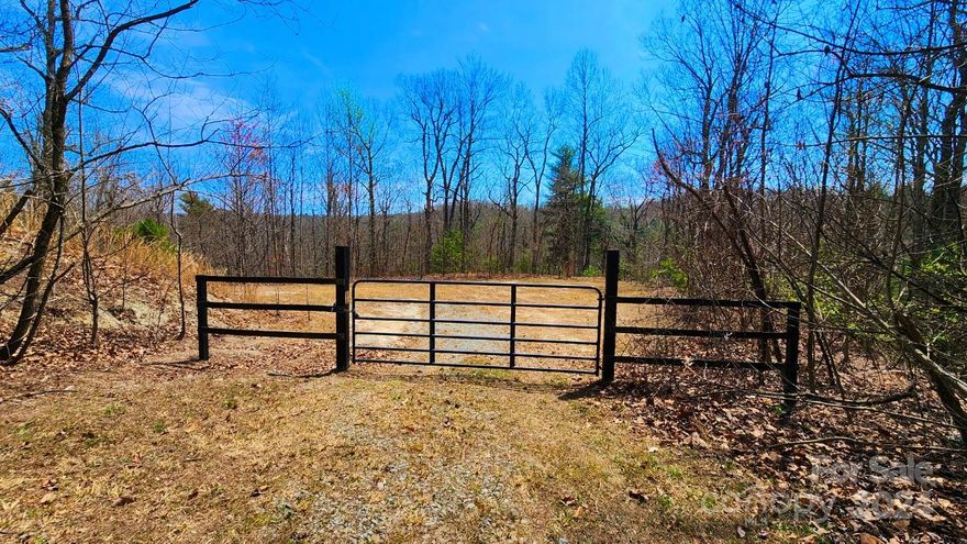 Quite possibly the BEST TWO LOTS in The Ridges of Pleasant Grove! 2 cul-de-sac lots have been combined, creating a wonderfully private space.  2 home pads have already been graded. A walking trail connects the two lots. Year round views with a front row seat to the fall colors and winter long range mountain views! Plenty of room for your custom build. Large enough for a detached MIL suite or guest house. The setting is very private. Close to Dupont Forest and Pisgah National Forest.