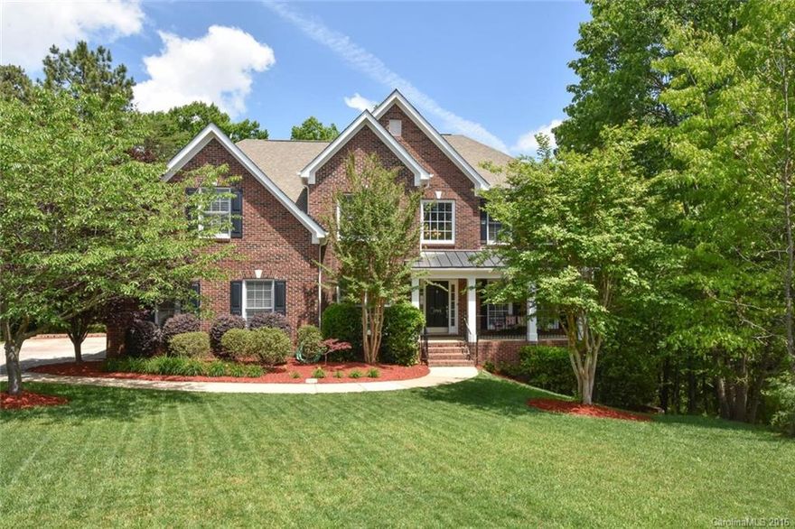 Welcome to Tega Cay with it's low property taxes, award winning schools, awesome community features, & short drive to Charlotte. Enjoy living in this well maintained 1st flr master brick beauty w/ 4,509 sq ft of HLA. Double Electrolux convection oven. Plantation shutters. Custom mahogany shelving. Freshly painted interior. Exterior power washed & all trim just painted. Lush wooded view from the extended deck. Custom finished basement w/bedroom & full bath, large rec/pool room, & great workshop.