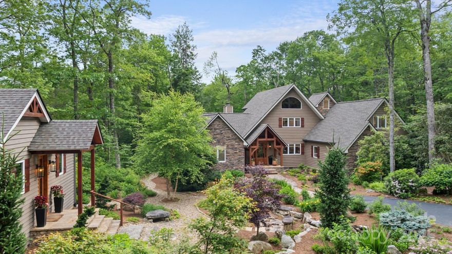 Experience refined mountain living in this beautifully furnished home in the gated Cullasaja Club in Highlands, NC. Includes a 3-bedroom main residence and a separate 1-bedroom guest house—ideal for hosting in style or offering private accommodations for friends and family. The main home features soaring beamed ceilings, an open kitchen and living area, two upper ensuite guest rooms, a cozy loft, and a main-level suite with cedar-lined walk-in closet. Outdoor living shines on the screened porch with a fireplace or the private hot tub deck overlooking the national forest. The guest house offers a full kitchen, cathedral ceilings, and an open living space. Enjoy rare level yards and an oversized 2-car garage. With membership approval, access club amenities: Arnold Palmer golf, tennis, croquet, fitness, pool, lake, fine dining, and more. From mornings on the fairway to evenings by the fire, live where nature meets luxury. Schedule your tour today!