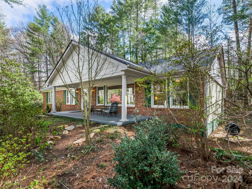 Nestled on a quiet cul-de-sac in the desirable Woodland Hills neighborhood of North Asheville, this meticulously maintained ranch offers a perfect blend of modern updates & classic charm. Boasting 3 bedrooms, 3 baths, & a basement with both family & bonus rooms, this home provides ample space for comfortable living. The beautifully updated kitchen is a chef's dream. Hardwood floors and tile throughout the main level add elegant touches. Step outside to discover your own private oasis, with an expansive covered deck and patio off the den. Surrounded by a large wooded lot with native plantings, privacy is paramount, offering a serene escape. Close to both Asheville and Weaverville, the home is centrally located to shopping and nearby amenities. This is a perfect place to call home.