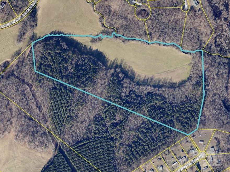 wooded property with approximately 19 acres located in flood plain.  The 19 acres is planted in fescue hay and produces fescue hay.  The remaining property is in trees with a nice hill side for potential building your home.
A creek and spring fed stream located on property lines for cattle or horses  etc.  A 60 foot deeded right of way from Crowders Creek Road about 350 feet takes you right to this beautiful property.   BE CAREFUL CROSSING THE BRIDGE.  DO NOT DRIVE YOUR VEHICLE ACROSS THE BRIDGE. Walk across the bridge with care.
 The big hay field will be on your left and the woods straight in front of the bridge .
****ADDITIONAL ACREAGE AVAILABLE 54 MORE ACRES JOINS THIS FARM. 
ALSO ANOTHER 40.76 ACRES AVAILABLE PLUS ANOTHER 43 APPROXIMATE ACRES .
TOTAL ACRES : 177 WITH THE PURCHASE OF 4 LISTINGS.  Buy one farm or all  4 farms.