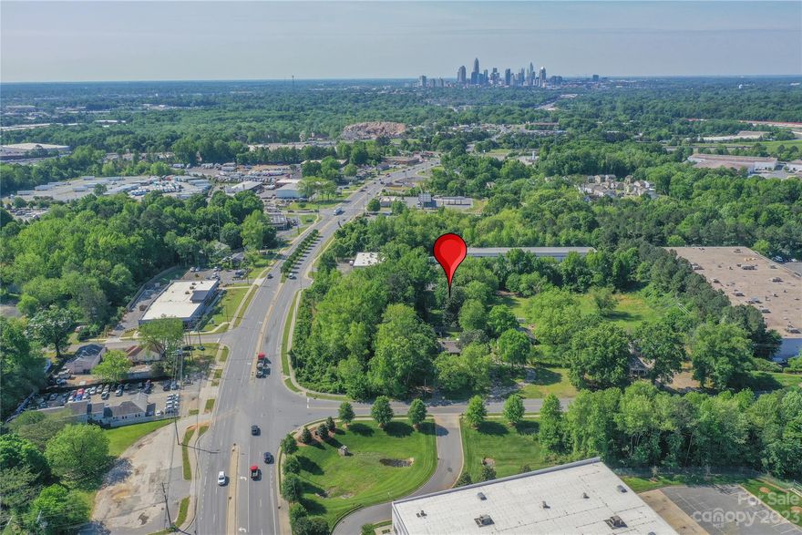 Minutes from Uptown, this quarter acre lot provides endless opportunities. Currently zoned residential, you could build housing for yourself or as an investment property. Or the new owner may choose to try to rezone for commercial use since it is right next to a business park. This is truly a rare opportunity in Charlotte for both residential and commercial developers. Lot is flat, green and mostly cleared. Access is via a cul-de-sac leading to business.  Water and Sewer taps needed. Close proximity to Camp Northend, NoDa, Plaza Midwood and Uptown. All showing requests must go through Showingtime.