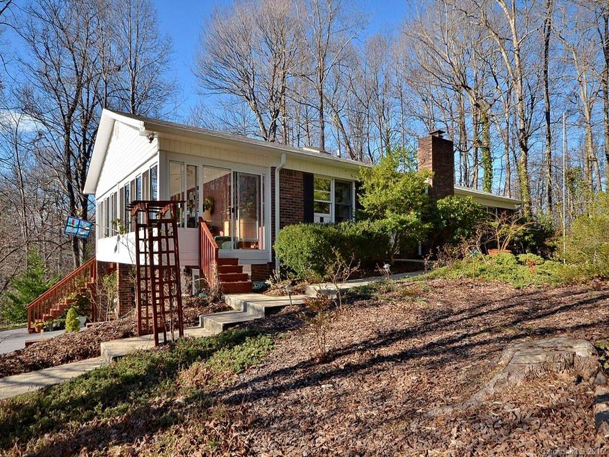 Winter mountain view from this beautiful split bedroom home in Haywood Knolls! Great room w/ cathedral ceiling, fireplace and hardwood floor, remodeled kitchen with solid surface counter, natural wood cabinets, large breakfast nook, spacious master suite w/ dual walk-in closets, delightful heated sun room has gas wall heater and southern exposure, finished lower level w/ media room & guest suite!