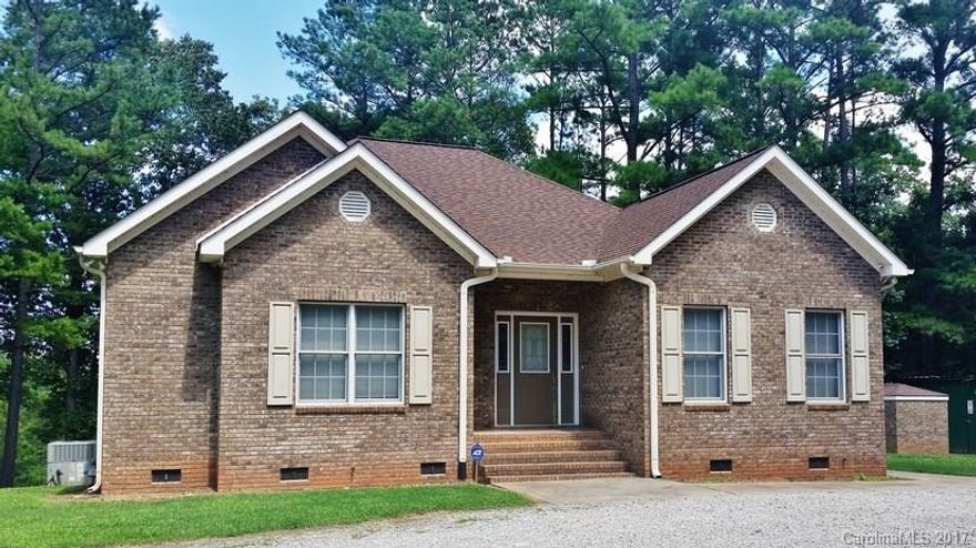 Spacious living in this custom built-one owner brick 1-story, big kitchen w/island-drawers-storage below, abundant cabinets for storage, open plan for the kitchen-dining-family room, great entertainment space, recessed ceiling lighting, split bedroom plan, laundry room with sink and cabinets, huge rap-around deck, out building for workshop or storage, combination open/wooded acreage with small pond, planned site for new Indian Land schools nearby on Hwy 521, convenient to Ballantyne area, I-485.