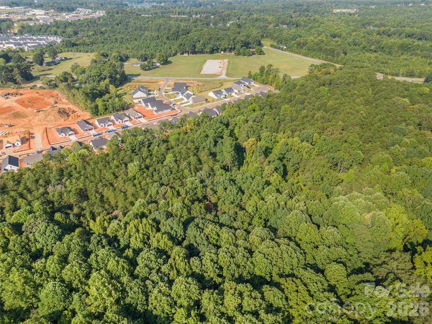 7 parcels totaling over 6 acres of land zoned Residential in Catawba County.  Conveniently located just 8 miles East of I-77 and 10 miles to Highway 16 in Denver. Located in fast growing area off Highway 150.  Property backs up to the Villas at Sherrills Ford new community.   Water / Sewer available just down the road.  Semi-level and dense topography suitable for small home development.  All lots for sale face McDonald Drive that ends with cul-de-sac.