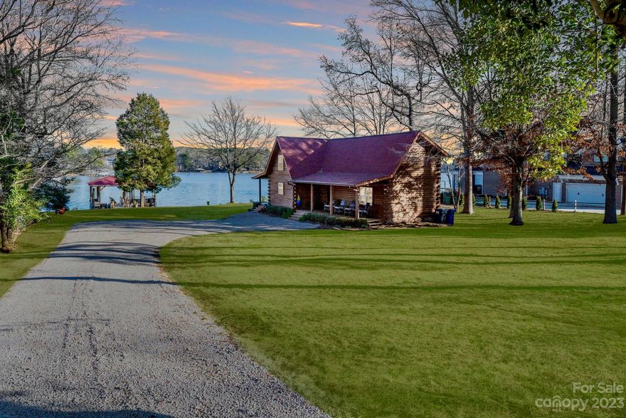 Escape to a lakeside paradise with this charming log cabin on Lake Norman, perfect for a dreamy vacation home or short-term rental. No HOA. Nestled along a peninsula just outside of Trump National Golf Club w/ breathtaking big water (and sunrise!)views, this retreat offers the perfect blend of rustic charm & modern comfort.  The spacious, flat lot invites endless outdoor adventures. Launch a kayak from the front yard, enjoy a scenic picnic lunch on the patio, take a boat ride in the afternoon, and soak up some rays on the sun deck after a fun filled day. Complete your evening w/ fireside chats under a star filled sky. This haven promises a perfect blend of relaxation & recreation, offering an idyllic retreat for unforgettable getaways. Whether this serves as your vacation retreat or primary residence, consider this log cabin your little slice of heaven on earth! Updated & move-in ready!