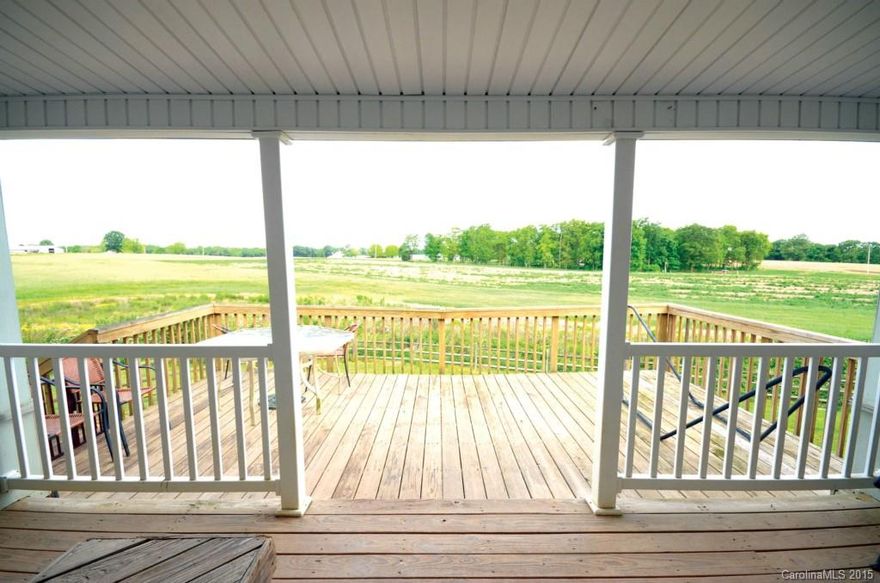 Looking for a tranquil place to call home? Well you've found it!  On 1.798 acres this lovely Ranch home is perfect for you! With over 3000 ft^2, the home has a large Master Bedroom with walk-in closet and access to a large storage closet. The Master Bath has dual vanity, garden tub and separate shower.  2 living areas on each side of the large eat-in Kitchen.  The main Family Room has a wood burning fireplace that can be enjoyed from the Dining Room as well. 2 covered Porches on front and back.