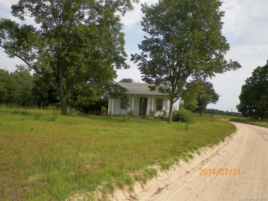 Build your country dream home or renovate the old house located on the 8.40 acres. There is a 7.15 acre parcel located directly across the unpaved county road from this parcel.  The old house located on the 8.40 acres has not been lived in for an extended period.  This country road is a mixture of attractive farm land parcels and country home sites.  It is located in close proximity to White Plains Golf Course.
