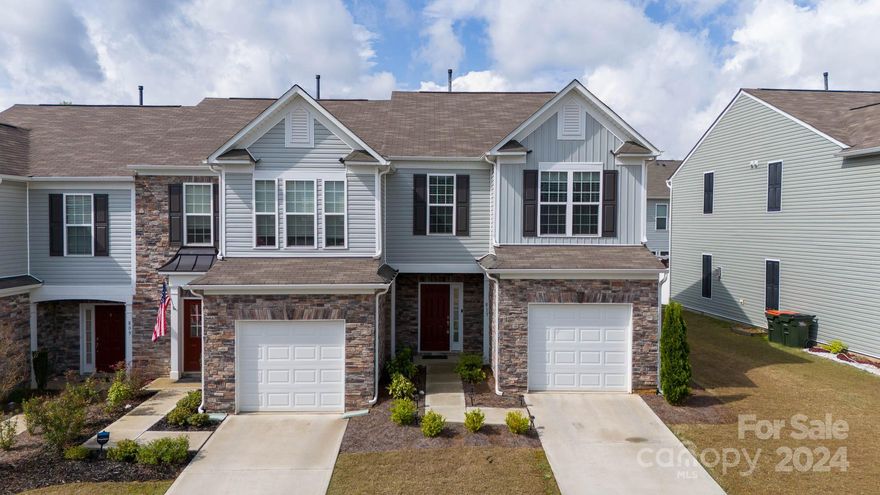 Welcome to your dream home! This stunning end unit townhome boasts the convenience of an attached garage and the luxury of modern amenities. Step inside and be greeted by an inviting open floorplan, seamlessly connecting the living, dining, and kitchen areas. The kitchen is a delight with stainless steel appliances, a pantry, a breakfast bar for casual dining, and elegant granite countertops that add both style and functionality. Retreat to the large primary suite where you'll find tranquility in the expansive walk-in closet, indulge in the tiled shower, and enjoy the convenience of dual sinks. There is also dual-fuel HVAC, utilizing both gas and electric systems. Nestled in a gated community, residents can enjoy access to a clubhouse for gatherings and a refreshing pool for leisurely afternoons. Experience the perfect blend of comfort, style, and convenience in this impeccable home.