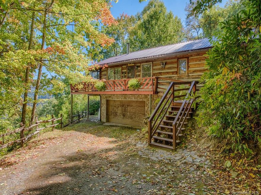 Awesome view of the entire Maggie valley from the screened porch of this charming 2 bedroom,2 bath log home in a gated community.  Surrounded by  the privacy of an acre of land, this home offers an Open floor plan, Vaulted ceilings, spacious master bedroom with walk in closet. Newer metal roof. Heat Vent in basement.Gas dryer at present but wired for elec also. Most furnishings included.