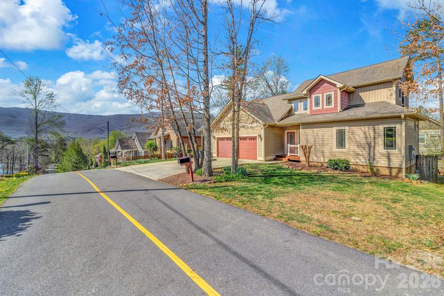 Ideally located in the heart of Black Mountain, this well-maintained duplex offers the rare combination of walkability, flexibility, and comfort—with sidewalk access just a short stroll to Lake Tomahawk and downtown Black Mountain. Enjoy easy access to trails, dining, shops, and community events right from your front door. This thoughtfully designed home features a primary bedroom on the main level, along with an open-concept living area highlighted by hardwood floors and a seamless, easy-to-maintain layout. The main level also includes a one-car garage for added convenience. Upstairs, you’ll find two additional bedrooms, a full bathroom, and a versatile bonus space perfect for a home office, library, media room, playroom, or fitness area—adaptable to fit your lifestyle. Outside, the fully fenced backyard provides privacy and functionality, ideal for pets, entertaining, or simply enjoying the outdoors from a covered back deck. With no HOA, low-maintenance living, and a highly desirable location, this property is perfectly suited as a full-time residence, lock-and-leave second home, or income-producing short-term rental (Airbnb). Opportunities like this in such a walkable Black Mountain location are hard to find.