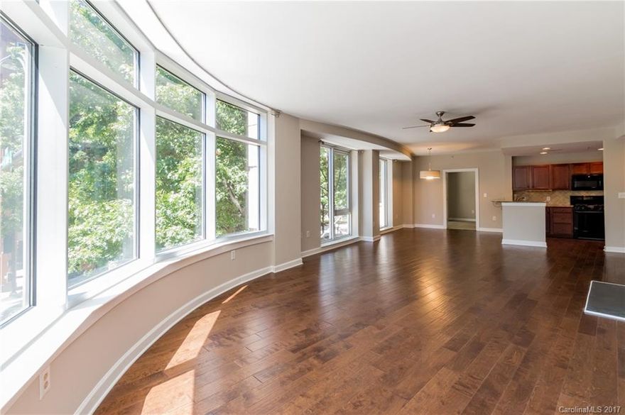 Updated corner unit overlooking Trade/Cedar with lots of natural light.  Private balcony / large windows / hardwoods / granite in kitchen. Fireplace in living area. Community POOL and ROOFTOP TERRACE with incredible views of Charlotte. Walk to Johnson & Wales.  Blocks from Panther, Knights games and Romare Beardon Park. Dry cleaner, restaurants and other amenities street level. Gym and Starbucks are across the street.