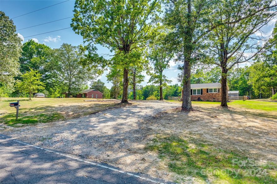 Beautiful quiet country setting for this brick ranch. Move right in! Feels like a brand new home. Everything was taken down to the studs in 2021 - ductwork, drywall, electrical. Fresh neutral paint throughout.  Granite countertops and stainless steel appliances in the kitchen. Laundry room with storage space off the kitchen.  Great location - convenient to both Clover and York, without being within city limits. Spacious, serene backyard with a newly installed split rail fence. Metal 20X24 shop with concrete flooring has power and a 12X20 lean-to extension. One man door and one overhead door. The sale fell through - no fault of the seller. Inspections have been completed - we are ready to close!