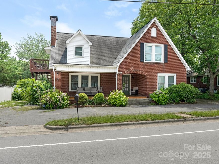 Beautiful brick home offers a rare blend of charm and versatility, spanning nearly 3,000sf with an expansive covered front porch perfect for relaxing. Nestled in the heart of Kannapolis, NC, this 1939 classic has been thoughtfully expanded to a 6 bedroom short-term rental coveted for large family gatherings and by corporate groups. Located just blocks from the vibrant, Kannapolis Research Campus and BioTech hub, this Office Institutional (O-I), zoned property provides exceptional flexibility, allowing live-work units, multifamily dwellings, residential care facilities, childcare centers, offices, studios, schools, and continued as a lucrative short-term rental with proven cash-flow. Spacious layout with 2000+sf ground floor, 16x24 outbuilding & ~300sf unfinished basement is ideal for customization. Investors will love the zoning’s potential for diverse income streams, while individuals can tailor it to personal or professional needs. Make 1102 Lane Street your best investment of 2025.
