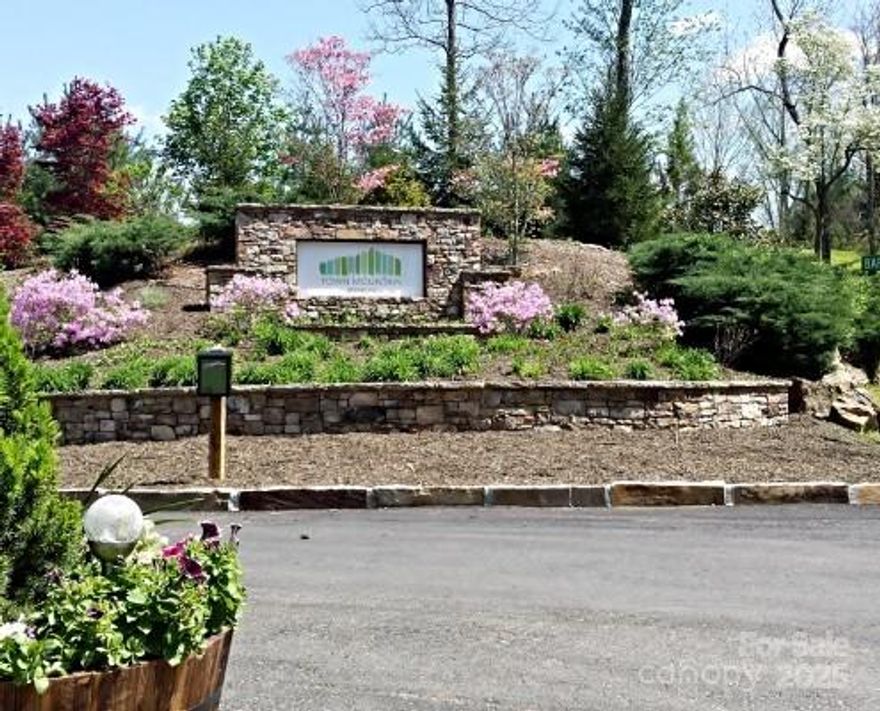 Gorgeous mountain views greet you as you enter Town Mountain Preserve. A private, gated community located just 2.5 miles from the heart of downtown Asheville. Luxury living in a mountain setting providing 2 gated entrances and private wooded lots for custom built homes. Enjoy all that the beautiful City of Asheville has to offer; shopping, dining and entertainment, all within minutes! This beautiful lot is 3.22 acres with stunning long range views.