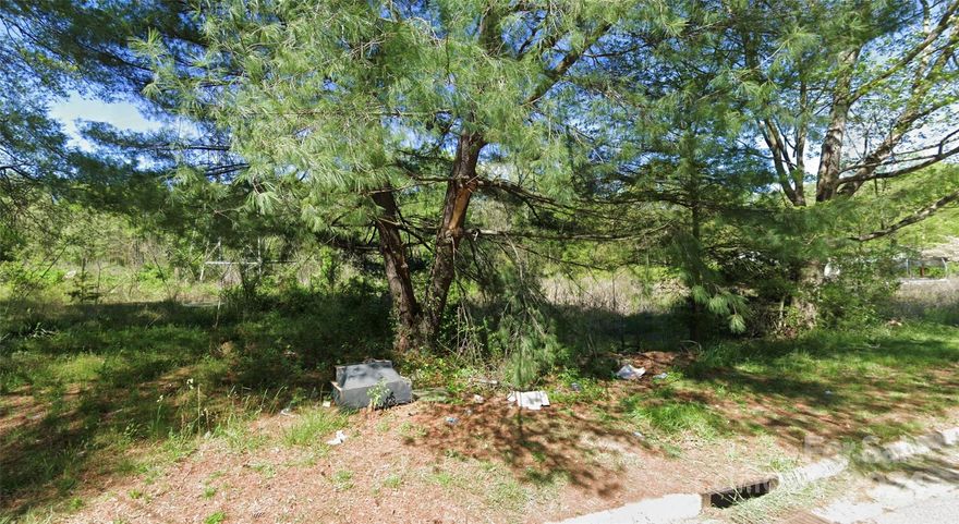 Flat building lot in Statesville.  Water and Sewer available, Appears there was previously a home here.