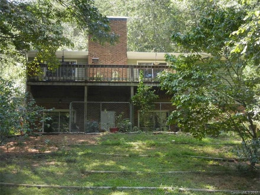 Carolina Forest-Make your escape to this 3 bedroom, 2 bath ranch on double waterfront lot.  New siding, new metal roof, new heat pump, new windows, new kitchen stove & hot water heater. Great room up with a fireplace; family room down with flagstone floor, new refrigerator, additional fireplace with wood stove, wet bar with tile floor & level walkout.  The home features large deck, patio, 8'x8' storage shed. Very private.  Located near the original boat ramp. Approx. 150' waterfront