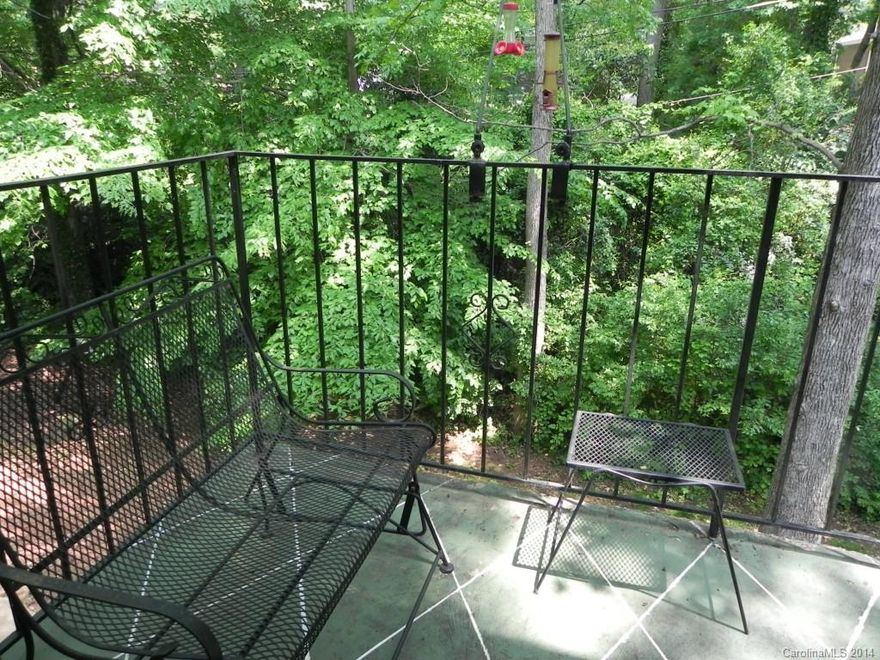 Rare offering!  Over 2700 sq ft in excellent condition, with bonus of extra large bedroom & full bath on lower level.  3 Bedrooms on upper level. Renovated kitchen: granite, stainless appliances, pretty white cabinetry.  Huge utility/ laundry area & storage room on lower level that buyers will love! New roof, interior paint. Tucked away in a corner of Trianon overlooking lush green space.  Walk to everything.  Private and quiet. HOA fee includes ALL expenses except electricity (see Attachments).