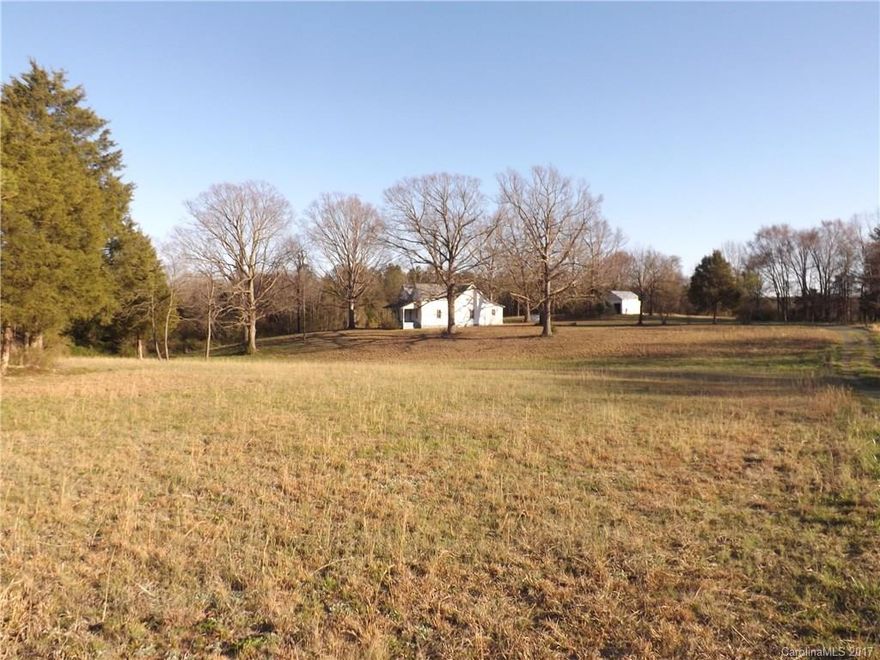 Unsurpassed home site is found on this 36.5 acre tract of country paradise. Large southern oak trees shade the present home that has a well and septic. Wander down the drive that goes to the pond and barn and you may spot wild turkey or deer in the woods. The pond surroundings is cleared and makes a great picnic /cookout area and you are totally secluded!!!  Make trails through the woods:  great for atvs and horse riding. Current home is in need of repair and is given no value.