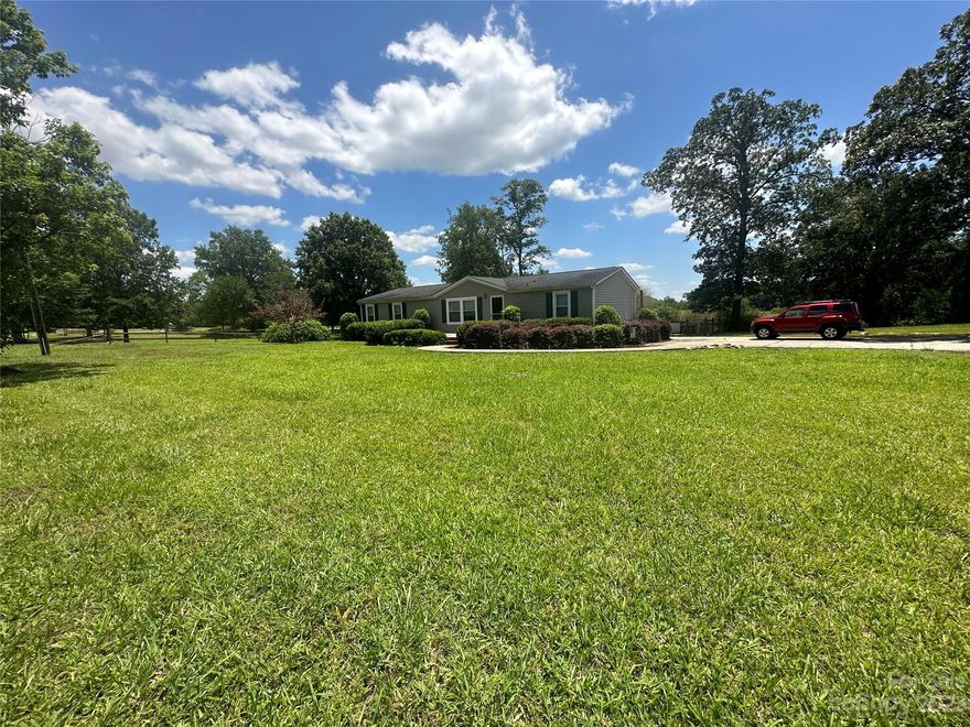 This amazing homesite boast a beautiful 17 acres of gently rolling pasture topography, two bay barn approximately 30x45 in size and 12x16 work shed with electricity in a close-in yet desirable country setting.  The acreage comes partially fenced and mostly cleared with wooded highlights and wooded terrain in the very back.  The home is postured at the front of the acreage and provides a split bedroom concept with the  primary bedroom inclusive of a flexible bonus/sitting room.  All appliances will convey:  Refrigerator, Washer/Dryer, Dishwasher and countertop microwave. Home appears to be in decent shape, just needs cosmetics.  HVAC is 5 yrs young.  The back is inclusive of an extensive patio area and sizable fenced dog pen.  Utilities for this property are electric, public water with a septic system.  This is the a wonderful opportunity to secure such beautiful topography with a close-in country setting.