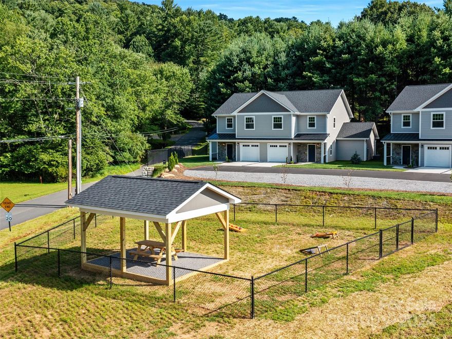 This new construction townhome with 4 BR and 3.5 Bath and 2262 sq. ft of heated living space has been well
planned to meet the owner's needs in multiple ways. Home designed and executed with a primary bedroom,
bath and laundry room on both the main and upper levels affording owners the ability to allow
multigenerational living on each level with built in privacy and to accommodate aging in place. The
attached 1 car garage entrance, front and back porches and a backyard with side fenced courtyard allow
homeowner to enjoy the land included in the purchase for outdoor activities. All 5 units owners get to
enjoy the fenced in dog park/safe play common green space area with cover picnic pavilion. Location is ideal in the
center of the quaint town of Burnsville within walking distance of all shops, eateries and watering holes.