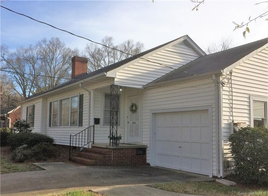 Charming older home, built to last, a classic beauty! Beautiful custom door. Original 50's kitchen w/ farmhouse sink. Covered Porch. Spacious 13x20 LR with FP.  Hardwoods under carpet.  Just minutes away from Hospital, Medical offices, Shopping, & Dining.  Newer 16x16 Master BR & 1/2 Bath with outside ramp access. Large level lot with beautiful oak trees...Garage with storage area plus storage bldg.  This home has been lovingly maintained, and is waiting for YOUR touches! HWA Warranty provided.