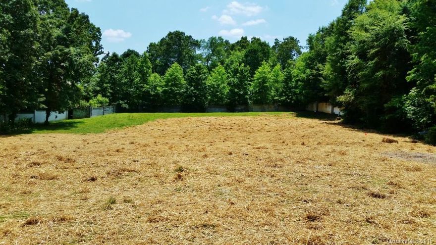 1 ACRE LOT in gated Seven Eagles. Perfect for designing and building your dream home.