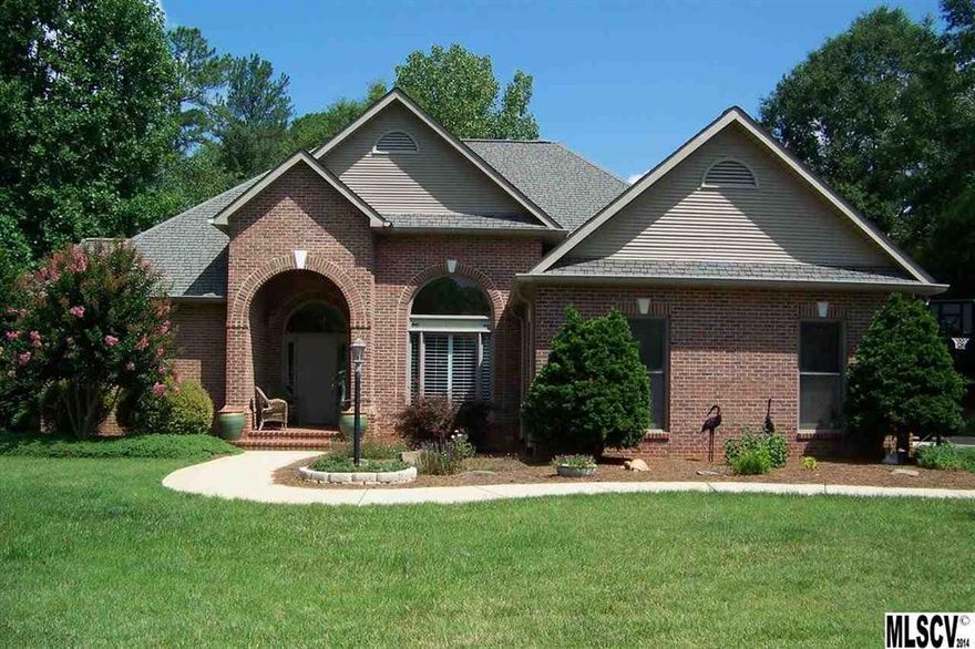 Wonderful open floor plan w/windows galore! Living Room with cathedral ceilings, hardwood floors throughout the home, flows into Dining Room w/plantation shutters. Crown molding throughout --even in closets. Eat-in kitchen with tray ceiling, tile counter tops, gas stove overlooking private backyard. Professional elegant painting done to accent the architecture of  this one level home. Laundry/mudroom connects 2-car garage & house. Master Suite w/tray ceiling that includes 3 long windows, tile shower, jetted tub, dual vanities, lots of closet space. The additional 2 bedrooms share a Jack & Jill bath. Relaxing patio overlooking flat lot. Outbuilding has garage door & power. Serene & Peaceful setting...yard is nicely landscaped, quiet location, & close to Hwy 321 & Hwy 16. 10 minutes to the mall , 45 minutes to Charlotte airport. Adjacent level lot to left available (Pin # 362912856607) for additional $15,000.