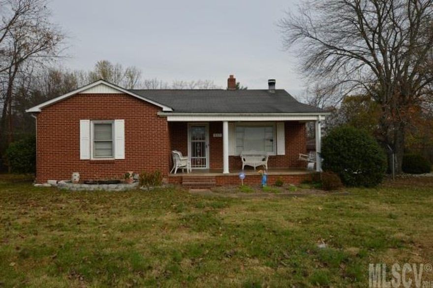 Nice 3 bedroom, 1.5 bath has has hardwood flooring in all 3 bedrooms. The eat in kitchen has lots of cabinetry. There's a nice covered front porch, The house is trimmed in vinyl for low maintenance. The unheated space in this listing is a 1037 sq. ft. 2 bedroom, 1 bath brick apartment behind the house and a 647' garage attached to the back of the apartment. The apartment has window air conditioner but currently has no heat. Former tenant used a space heater. The ceilings in the are less than 8' in the apartment. The house has city sewer and water. The apartment has city water and a septic tank. Price way below tax value! Good investment property!