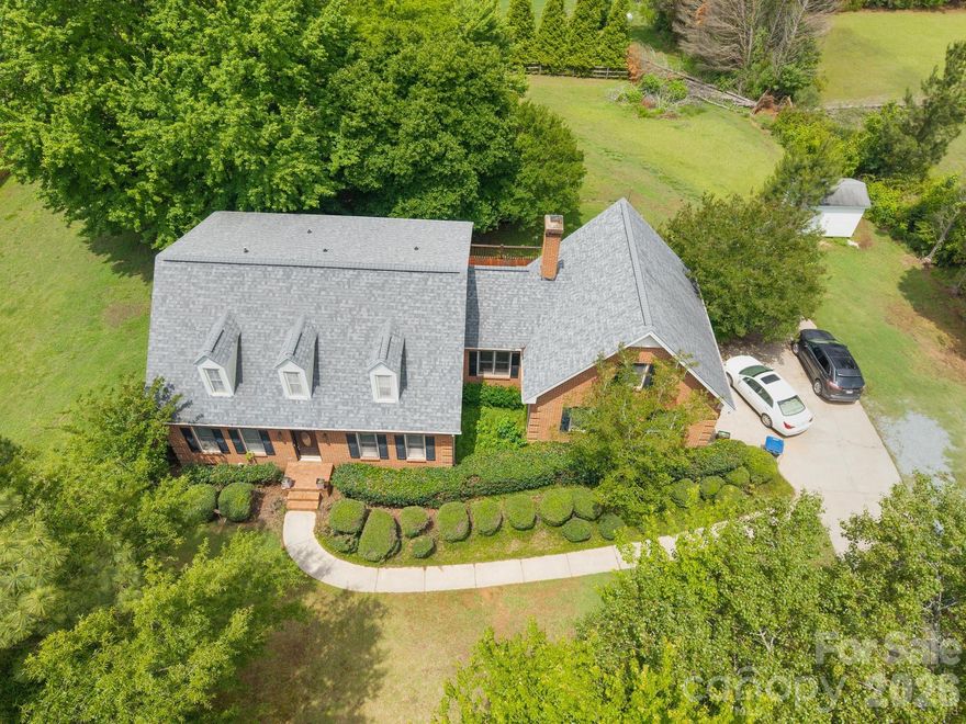 Amazing value in Weddington! This full-brick, 4-bedroom home features a fantastic, comfortable floor plan. The main level includes a kitchen that flows directly into the den, complete with new sliding glass doors opening to the deck and level backyard. Upstairs, a separate staircase leads to a large recreation room. The 4th bedroom on the main floor is perfect for its current use as an office. Updates include a new deck awning in 2025. Convenient to shopping! 
Property is subject to the NCDOT Providence Road expansion—see attached docs for details.