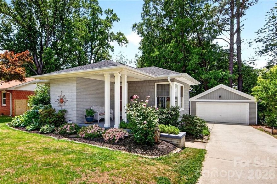 Gorgeous Bungalow with a 2 CAR GARAGE in a prime and private location!  Large and open kitchen with extra counter space, double drawers, and a large pantry.  Newer SS gas range, fridge, and Bosch dishwasher.  Convenient fenced-in side patio ideal for morning coffee.   Beautiful refinished hardwoods, fresh paint, and spacious closets throughout.  Large primary suite featuring double sinks, custom tile, and a walk-in closet.  Incredible rear addition Great Room with extra windows, peaked ceiling, and tons of natural light.  The room overlooks a spacious rear deck, mature trees, and a fenced-in yard.  The crawlspace below has a poured concrete floor with a new vapor barrier.  Amazing location near Midwood and NoDa.  Steps away from Harris Teeter, Summit Coffee, Postscript, Hattie's, Grey's Diner, and other top restaurants/nightlife.  Completely move-in ready home with a storybook curb appeal!
