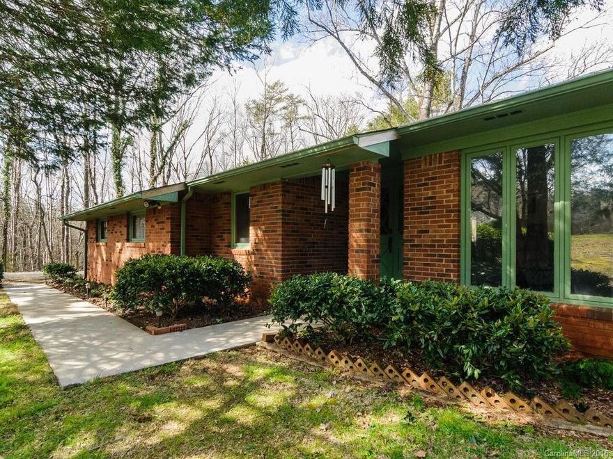 Priced below appraisal!! All brick on almost one private acre, and under $200,000!  This home has almost 2000sf, laminate floors throughout, natural gas, brick fireplace, built in shelves, lots of living space, galley style kitchen w/ breakfast bar, cozy breakfast nook with bay window, and lots of character! Large screened in back porch for relaxing.  Huge lot for entertaining!