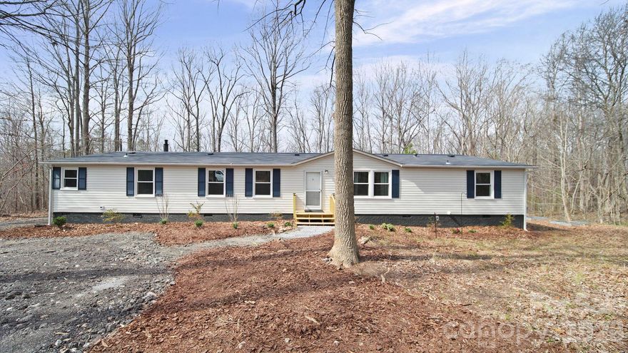 Wow! Check out this recently renovated mobile home situated on 3.98+/- Acres. This home has approximately 2105 heated square feet.  Nice, split bedroom plan with 4 Bedrooms and 2 Bathrooms. This home also has 3 sitting areas. Wonderful kitchen with stainless steel appliances, tile backsplash, tile flooring, granite countertops and new white cabinets. Refrigerator, Washer and Dryer are not new but will remain. The primary suite features a sitting area, walk in closet, separate tile shower, separate bath tub, and double sinks. HVAC System and Roof were recently replaced. Enjoy the outdoors by spending time with you friends and family at the back yard firepit.  Detached storage building will remain. Do not miss the opportunity to see this home!