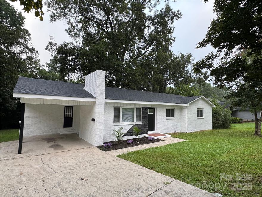 Welcome Home! This beautifully updated 3 bed, 2 bath home is ready for move in. Home features a spacious living room with a wood burning fireplace, that is perfect for those cold winter nights. Kitchen has ample cabinet space, a walk-in pantry and stainless-steel appliances. Master bedroom provides just the right amount of comfortable living space and master bath features a gorgeous walk-in shower. When it's time for some fresh air, step outside into a large backyard that is ideal for family cookouts and gatherings. Brand new LVP flooring through out as well as brand new carpet in each bedroom bring this lovely home to life. New roof as of 2025. Home is conveniently located near I85, Brookshire Blvd and just a short drive to Uptown.