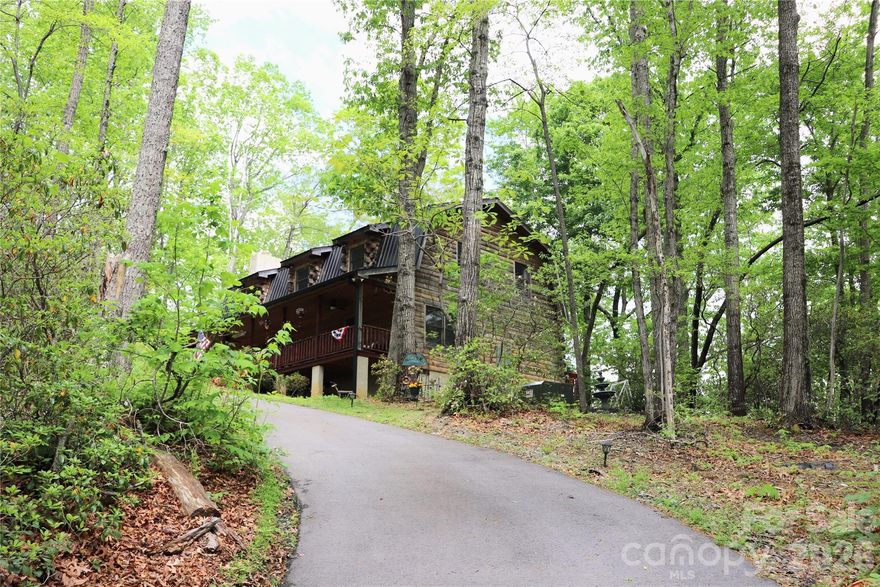 MAJOR PRICE REDUCTION – MOTIVATED SELLER – WILL CONSIDER ALL OFFERS!
Private log cabin for sale in Western North Carolina on 10.07 wooded acres with long-range mountain views — ideal for a vacation home, short-term rental, Airbnb, or VRBO investment property near Lake Lure and Chimney Rock.
This authentic mountain log cabin retreat features 3 bedrooms plus a bonus room (commonly used as a 4th bedroom), 2 full baths, and an open-concept floor plan designed for comfortable full-time living or second home use. The main level offers single-level living with a primary suite, laundry, and bright sunroom — a highly searched feature for buyers seeking convenience in a mountain home.
A wood-burning fireplace creates the cozy atmosphere buyers expect in a North Carolina mountain cabin, making it especially appealing for vacation rental guests.
Enjoy outdoor living with a covered front porch and spacious back deck with mountain views — perfect for relaxing, entertaining, and maximizing short-term rental appeal.

The upper level includes additional bedrooms, full bath, and a loft-style living area — ideal for hosting guests, large groups, or increasing rental income potential.

For investors, this property offers a turnkey opportunity with select furnishings available, allowing for quick setup as a short-term rental cabin near Lake Lure.

Prime location for both lifestyle and investment:
• 6 miles to Lake Lure
• 5 miles to Chimney Rock State Park
• 13 miles to Fairview
• 15 miles to Black Mountain
• 30 miles to Hendersonville

   Close to hiking, waterfalls, boating, restaurants, and breweries, this property offers the balance buyers want: private mountain setting with convenient access to top Western NC attractions.

Whether you're searching for a private mountain home, log cabin getaway, second home, or vacation rental/ income-producing Airbnb investment, this property delivers acreage, privacy, views, and strong rental potential.

Mountain living the way buyers are searching for it — private, scenic, and investment-ready.