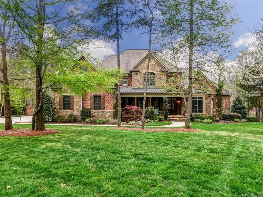 Relax where you live in this beautiful Custom Waterfront home in this sought out Gated Community. Inside you will find a bright+open floor plan offering 4 Bedrooms+2 bonus rooms or 5th bedroom+Bonus,tall ceilings with 8' doors,hardwoods throughout.Master+guest suite on main.Huge Gourmet kitchen w/upgraded SS appliances including NEW 42" Fridge, walk in pantry. Over $200K spent on large patio,fire pit,and covered screened area addition overlooking pond on pool ready flat yard. Weddington Schools!