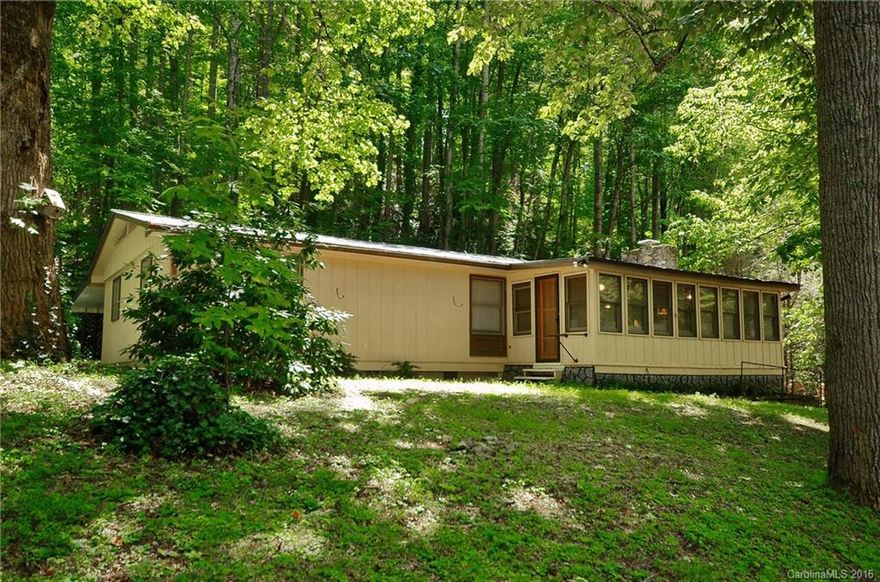 A Park-Like Setting with towering trees and a level yard surrounding this completely furnished ranch just minutes from town and the Maggie Valley festival grounds. With 3 bedrooms and 2 baths, living room with fireplace, kitchen with breakfast bar, dining area, plus a sun-room, you'll have plenty of room for family and friends.