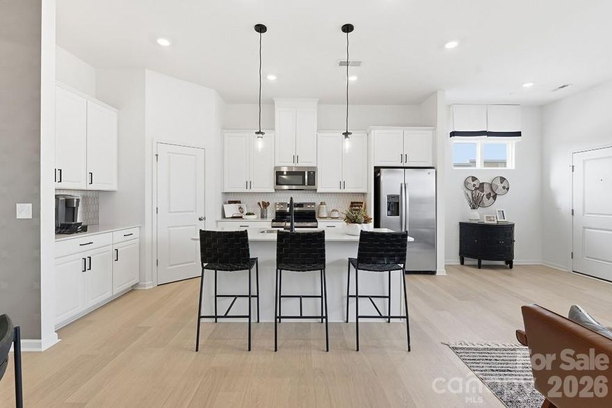 What's Special: Gourmet Kitchen | End Unit | Loft | Covered Patio. New Construction - Ready Now! Built by America's Most Trusted Home Builder. Welcome to the Avon at 5545 Wolfpack Alley in Terraces at The Exchange! This charming two story townhome offers a thoughtful layout that brings comfort and ease to everyday living. The first floor begins with a welcoming entry from the rear two car garage that leads directly into a bright kitchen with a walk in pantry and a casual dining area. A spacious great room sits at the front of the home and creates the perfect place for gathering, while a convenient half bath completes the main level. Upstairs, a cozy loft at the top of the stairs invites relaxed evenings and simple fun. Three bedrooms, including the beautifully designed primary suite, share the second floor along with the centrally located laundry room for added convenience. Residents will enjoy walkability to the Exchange, a brand-new development that will feature a Lowe's Foods, Costco, Cold Stone Creamery, Club Pilates Hollywood Feed, Halal Street Food, and more. Located off Highway 521, enjoy easy access to I-485, I-77 and I-85. The area is growing and thriving! Right down the road is a brand-new Swig and CrossRidge shopping center, featuring a Target and YMCA. Discover the nearby Promenade at Carolina Reserve, which holds a T.J. Maxx, HomeGoods, Starbucks, Crumbl, and so much more! Ready for a vacation? You’re just 30 miles from Charlotte Douglas International Airport. Additional Highlights Include: gourmet kitchen, white cabinets and Revwood on the first floor. Photos are for representative purposes only. MLS#4358297