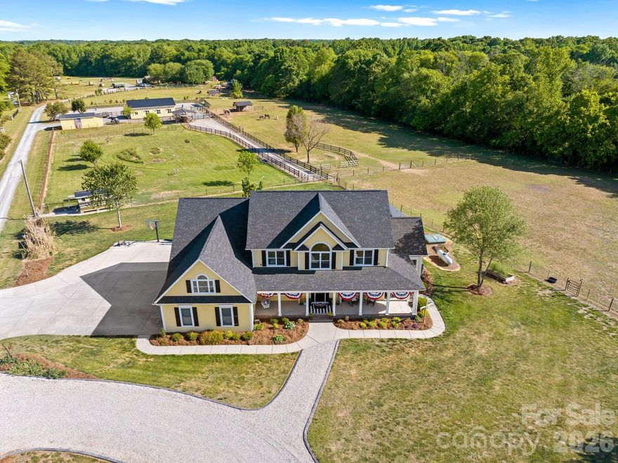 Experience the ultimate country lifestyle on this breathtaking 11.7-acre farm, perfectly designed for both everyday living and equestrian pursuits. This picturesque property invites you to slow down, spread out, and enjoy the beauty of wide-open pastures, where horses, cows, goats, and chickens can thrive.

The thoughtfully updated home features a completely renovated kitchen with new cabinetry, countertops, and appliances—creating a warm and inviting space for gathering with family and friends. The main level offers a spacious primary suite along with a versatile office (with closets), while upstairs you’ll find three generously sized bedrooms, a large LOFT with bookshelves, and an expansive recreation room, plus walk-in attic storage. Relax and take in the scenic views from the charming wraparound front porch or unwind on the screened porch overlooking the rolling pastures.

Equestrian enthusiasts will appreciate the renovated six-stall barn equipped with automatic waterers, a tack room, hayloft with conveyor system, and double run-ins. The impressive riding arena (approximately 120’ x 90’) is ideal for dressage and training. Four fenced pastures provide ample space for grazing and rotation. A matching storage shed with barn door adds additional functionality, and farm equipment and animals are negotiable. And of course the quaint chicken coup coordinates with the house, barn and shed! 

This is more than a home—it’s a lifestyle opportunity to live, work, and play on your very own private farm while being only minutes from restaurants, shopping and entertainment!