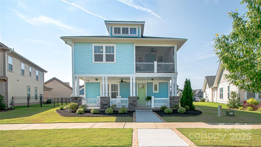 Welcome to this stunning Craftsman-style home that blends timeless character w/ modern conveniences in the highly sought-after, amenity-rich Riverwalk community, just minutes from shopping, dining, & I-77. The chef's kitchen features gas range, sleek quartz countertops, & stylish wine bar w/ wine refrigerator. The spacious family room flows seamlessly into the kitchen. Filled w/ natural light it creates an inviting, open living space. Enjoy Southern living at its finest on the inviting rocking chair front porch. The fenced backyard features a covered patio, & a screened-in porch on the 2nd floor offers a private retreat w/ peaceful views. An ample flex space on the main level offers endless possibilities—use it as a home office, fitness studio, playroom, or guest suite. The primary luxury suite is a true retreat featuring 2 walk-in closets & an oversized spa-like w/ rainfall showerhead. Don't miss your chance to own this beautifully designed home in one of the most vibrant communities!