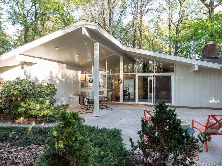 WOW!  Rare MCM in Cotswold!  That's right, one of the few Mid-Century Modern ranches available near town has hit the market.  Walls of floor to ceiling glass look out to the wooded lot. Just minutes from Cotswold, Southpark and Uptown.  Perfect for entertaining with many of it's original features like slate and wood paneled den with martini bar.  This home was expanded in the 90's with a bonus room addition that is great for hanging out or could be a 4th bedroom. Lovely party patios.
